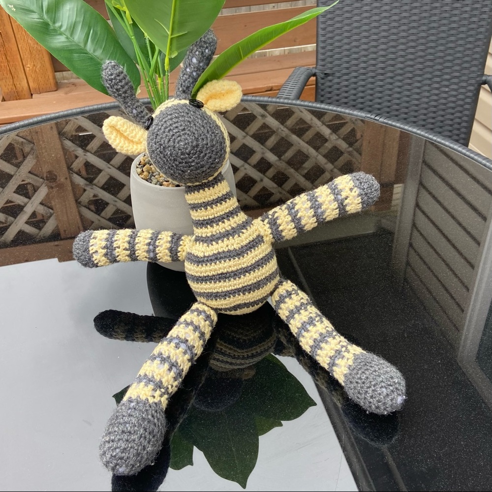 Handmade crochet grey and cream socks monkey. Good used condition.